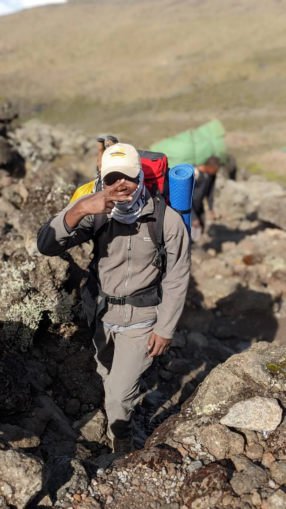 Godwin Nyerere, Founder and Lead Guide at Resilience Safaris, on the slopes of Kilimanjaro